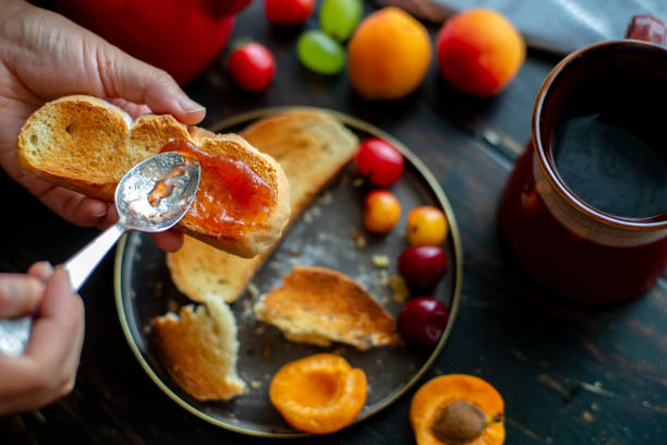 View from above of a loaf of bread with apricot jam 